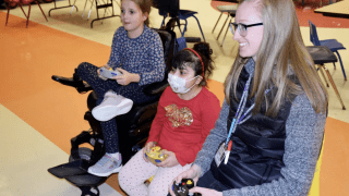 Therapist playing video games with patients