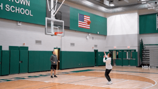 basketball player taking a shot