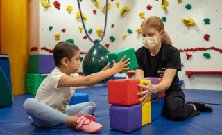 Occupational Therapist working with patient