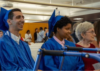 two graduates in classroom