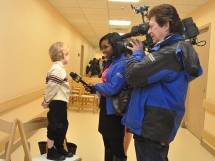 reporters with child asking them questions