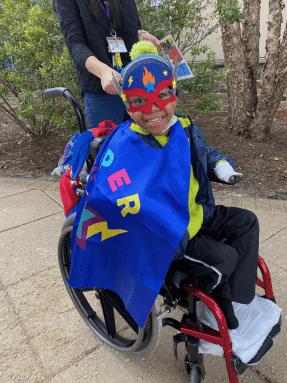 child in a superhero costume