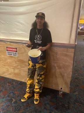 Photo of young teenager with a bowl of popcorn